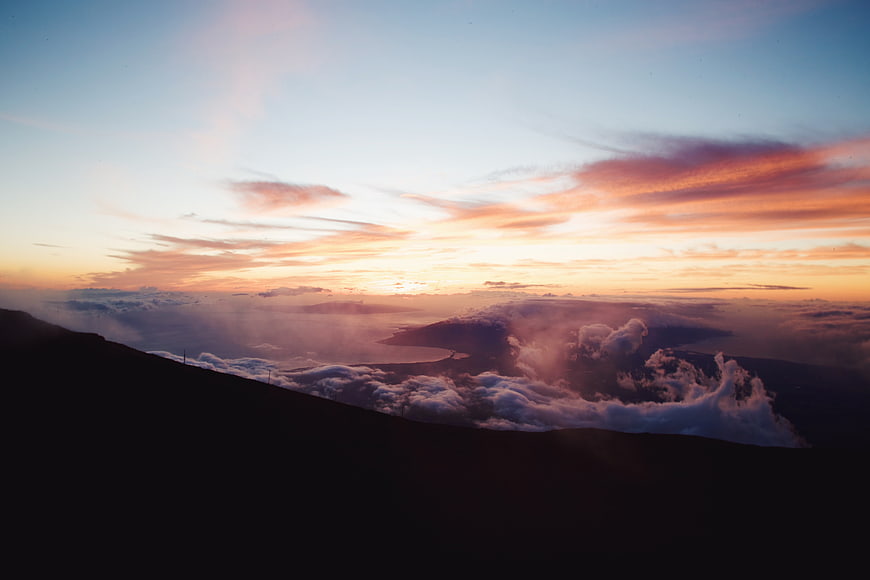 Dramatic Sunset Over Mountain Ridge and Cloud Sea