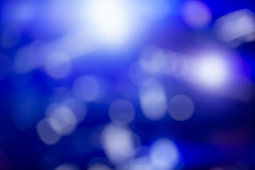 Abstract Blue Bokeh Background with Glowing Lights