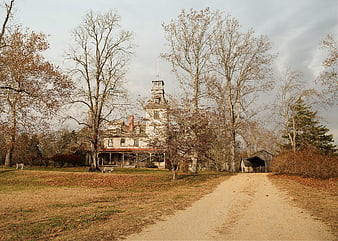 Historic Victorian Mansion in Autumn Landscape