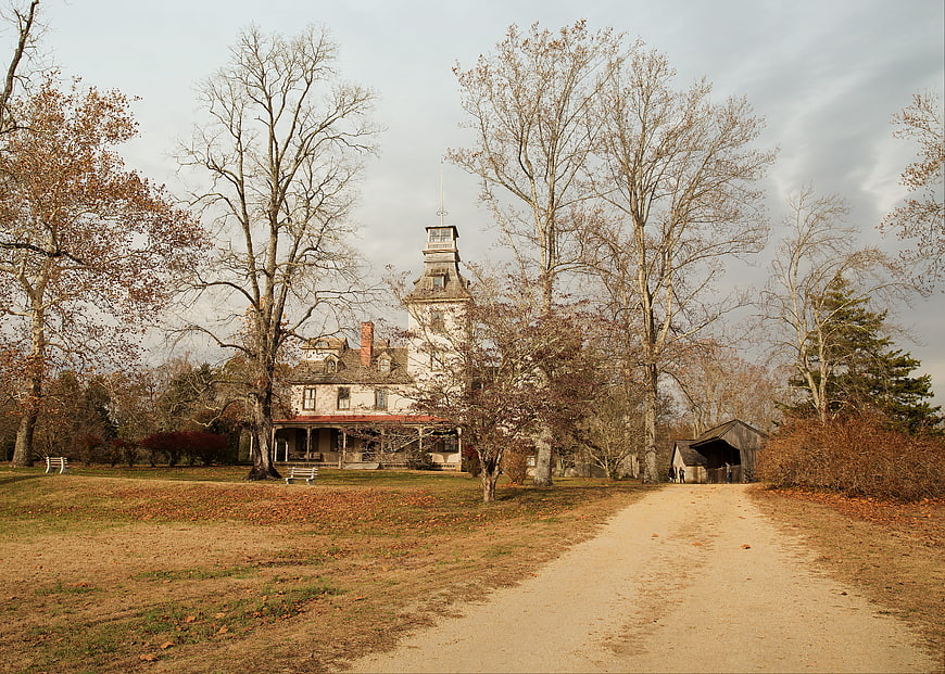 Historic Victorian Mansion in Autumn Landscape