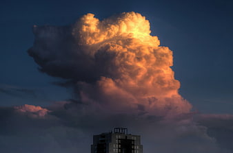 Dramatic Golden Sunset Cloud Over City Building