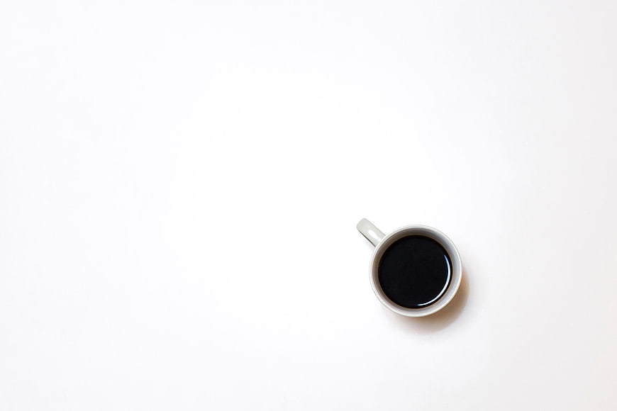 Minimalist Top View of Black Coffee in White Cup