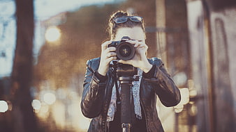 Woman Photographer Taking Photo with DSLR Camera Outdoors