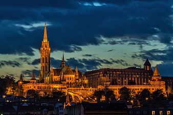Illuminated Matthias Church and Buda Castle at Twilight