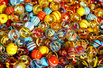 Colorful glass marbles close-up pattern background