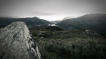 Misty Mountain Valley Landscape with Foreground Rock