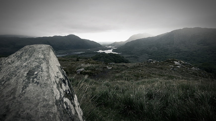 Misty Mountain Valley Landscape with Foreground Rock