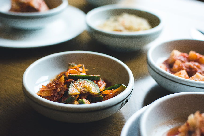Close-up of Korean side dishes in ceramic bowls
