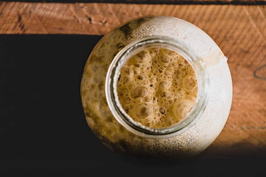 Top View of Fermenting Sourdough Starter in Glass Jar