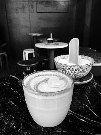 Black and white latte art coffee on marble table