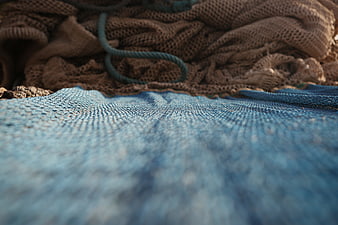 Close-up of blue and brown fishing nets with rope