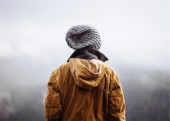 Man in Beanie and Corduroy Jacket Looking at Foggy View
