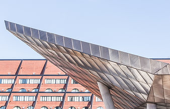 Modern Steel Canopy Overhang Against Brick Building