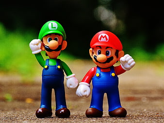 Mario and Luigi figurines standing on a path