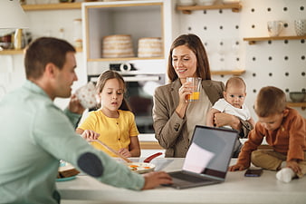Happy family having breakfast together in modern kitchen