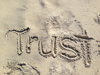 Word Trust Written in Sand on Beach