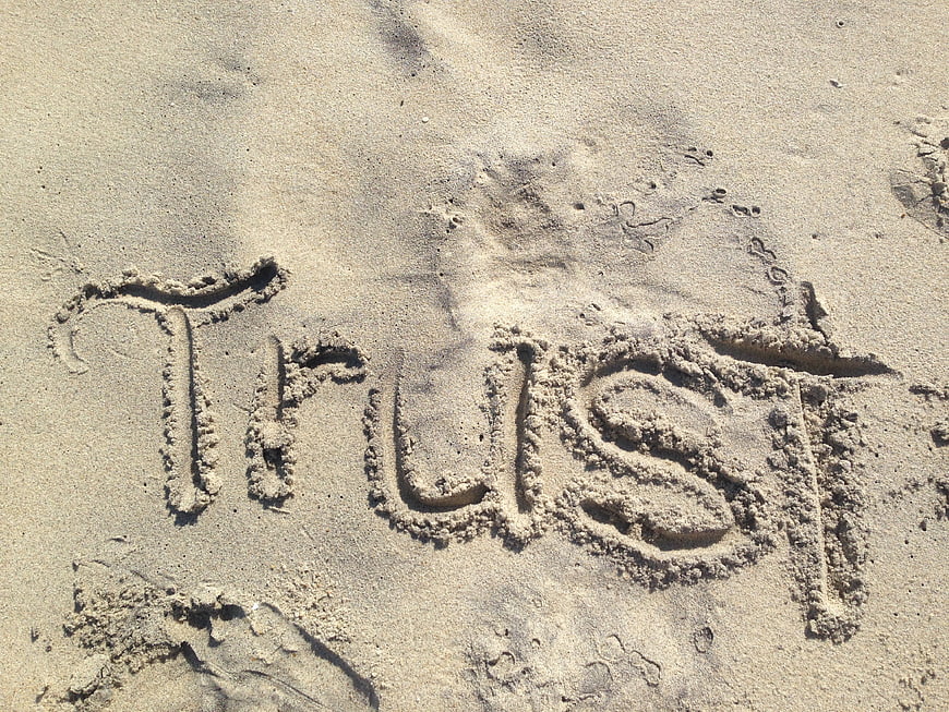 Word Trust Written in Sand on Beach