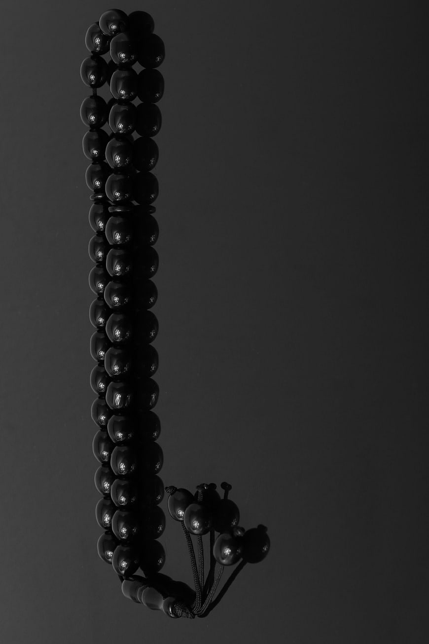 Black Prayer Beads on Dark Background