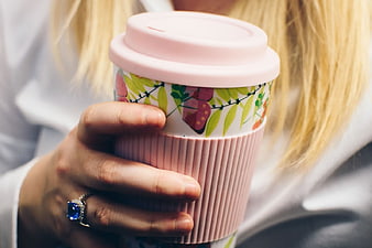 Woman Holding Pink Floral Reusable Coffee Cup
