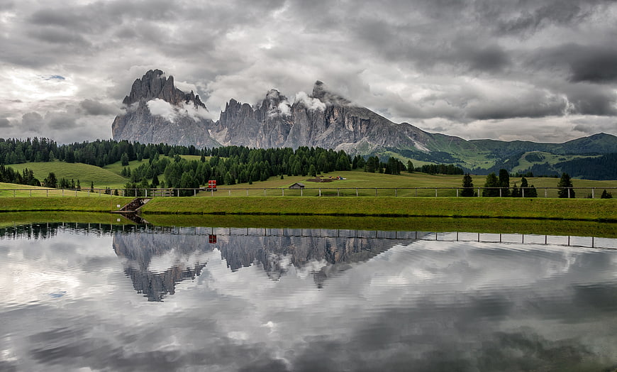 Dramatic Dolomites mountain reflection in alpine lake
