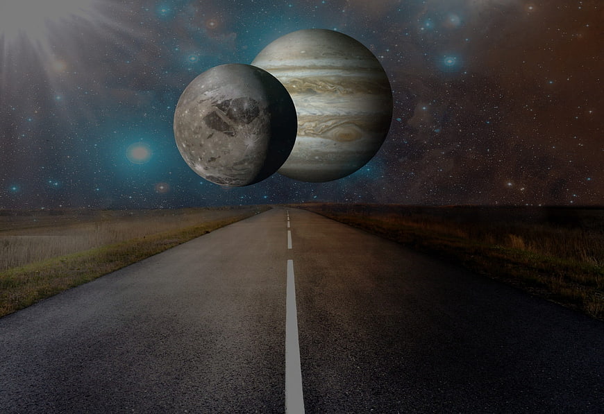 Surreal road leading to giant planets in starry night sky