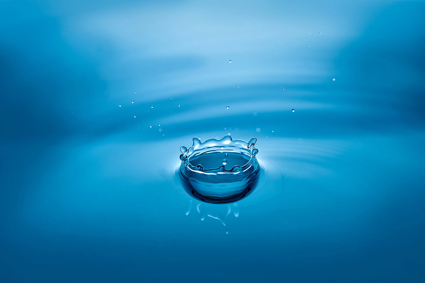 Blue Water Drop Splash Crown on Liquid Surface