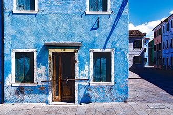 Vibrant Blue Building Facade in Burano, Italy