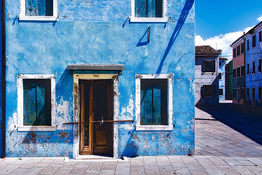 Vibrant Blue Building Facade in Burano, Italy