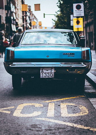 Rear view of vintage blue Dodge 3700 classic car on city street