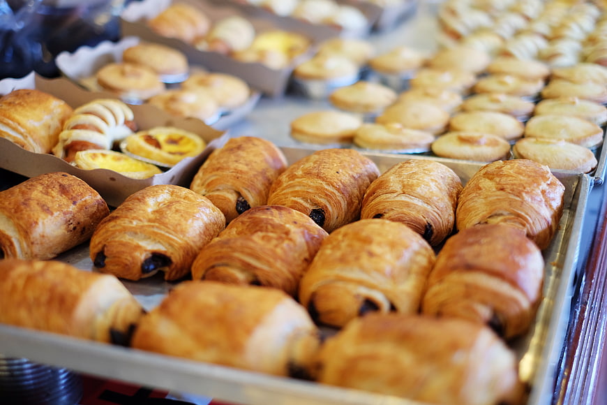 Freshly baked croissants and pastries in bakery display