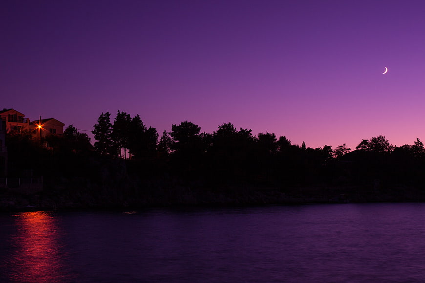 Crescent Moon Over Purple Twilight Sea Landscape
