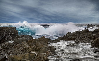Powerful Ocean Waves Crashing Against Rocky Coastline