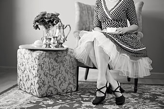 Vintage Black and White Tea Party Scene with Woman in Polka Dot Dress