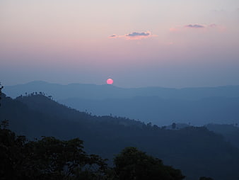 Pink Sunset Over Hazy Blue Mountain Ranges