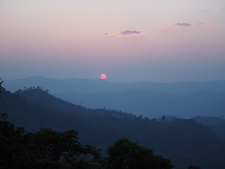 Pink Sunset Over Hazy Blue Mountain Ranges