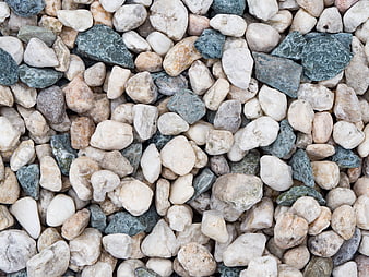 Close-up texture of mixed white and gray river stones