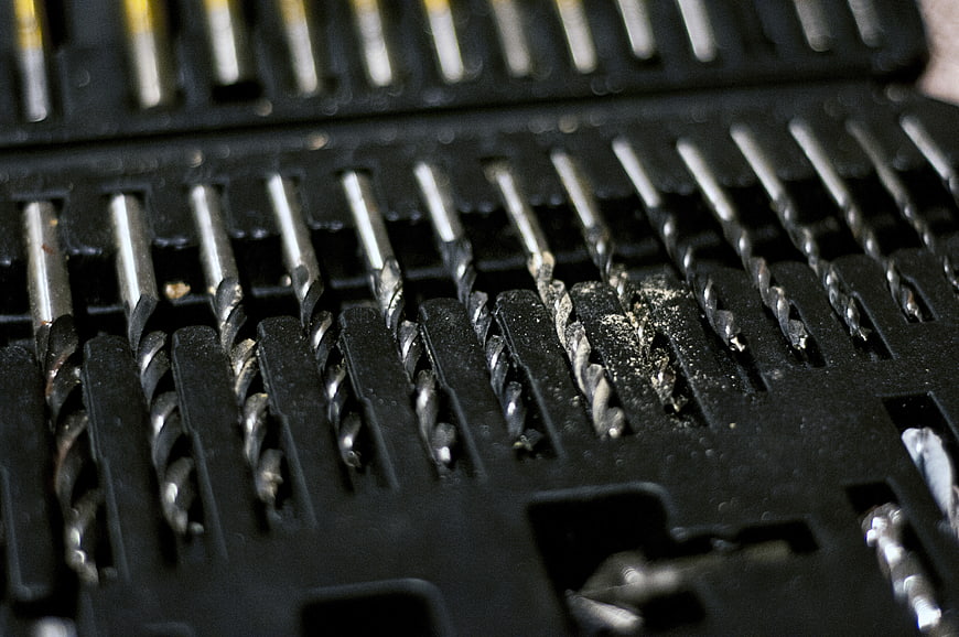 Close-up of metal drill bits in black case