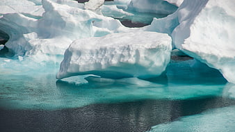 Floating Iceberg in Turquoise Arctic Waters