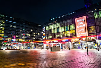 Empty Urban Square at Night with Neon Lights