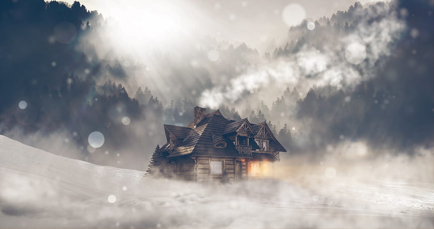 Cozy Log Cabin In Snowy Mountain Landscape With Fog And Light