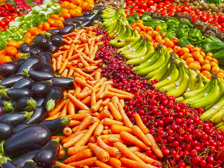 Colorful variety of fresh fruits and vegetables at market