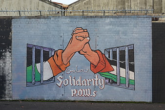 Solidarity POWs Mural on Brick Wall in Belfast