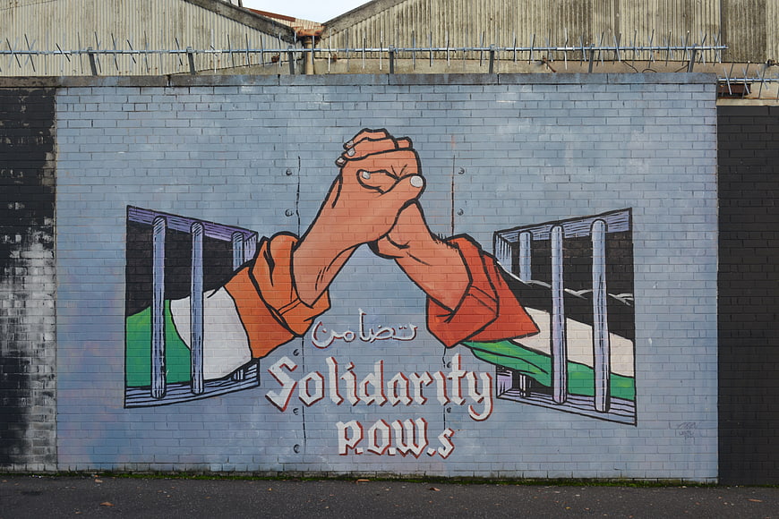 Solidarity POWs Mural on Brick Wall in Belfast
