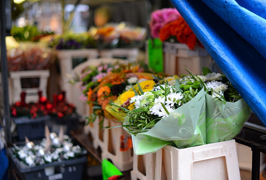 Colorful flower bouquets at outdoor market stall