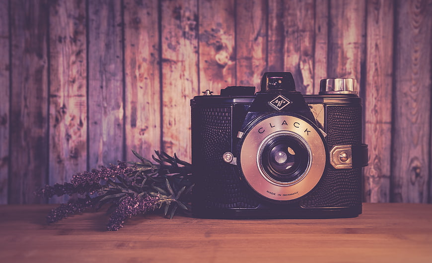 Vintage Clack Camera on Wooden Table with Lavender