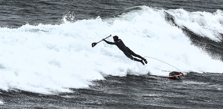 Surfer Wipeout on Ocean Wave