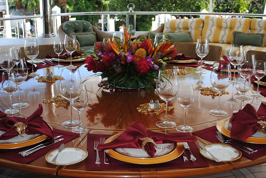 Elegant Outdoor Formal Dining Table Setting with Floral Centerpiece
