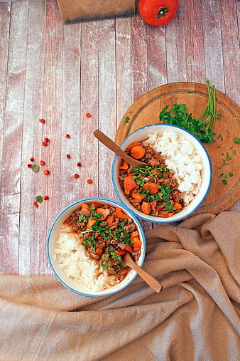 Top View of Ground Beef and Rice Bowls on Rustic Wood