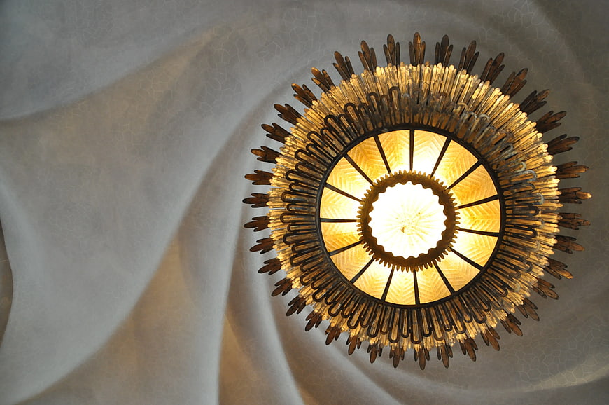 Ornate Sunburst Ceiling Light Fixture with Warm Glow