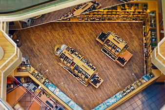 High-angle view of wine shop interior with wooden shelves